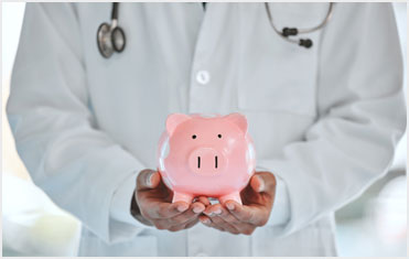 doctor holding piggy bank